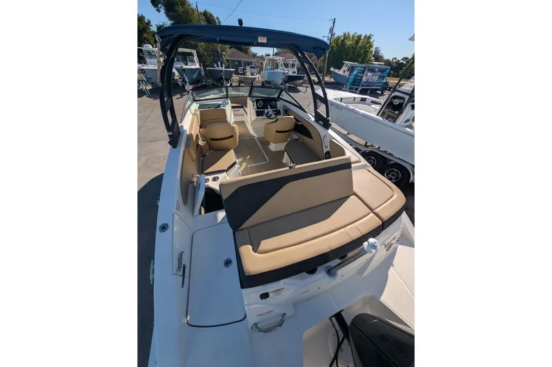 Slide: The Image of 2021 Sea Ray 21 SPX OB boat interior with tan seating and black accents. - 4