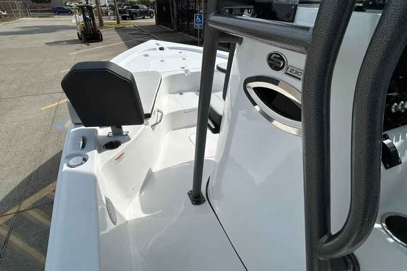 Slide: The Image of 2026 Sea Pro 230 Bay boat interior with seating and console details. - 12
