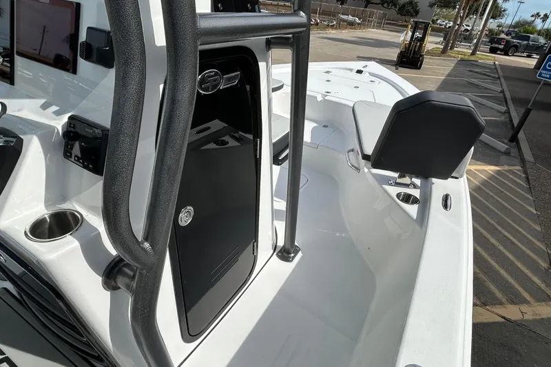 Slide: The Image of 2026 Sea Pro 230 Bay boat interior with seating and console details. - 13