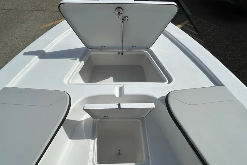 Slide: The Image of 2026 Sea Pro 230 Bay boat storage compartments with open hatches, showcasing ample space. - 16