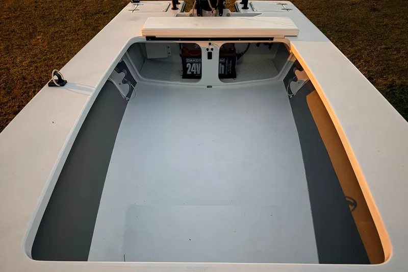 Slide: The Image of 2004 Hell's Bay Devilray boat interior with storage compartments and equipment. - 21