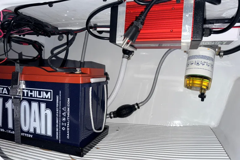 Slide: The Image of 2004 Hell's Bay Devilray boat battery setup with Dakota Lithium 110Ah battery and wiring. - 28