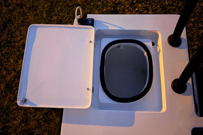 Slide: The Image of Open hatch on 2004 Hell's Bay Devilray boat, showing interior compartment. - 31