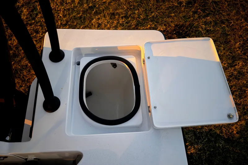 Slide: The Image of 2004 Hell's Bay Devilray boat hatch open, revealing storage compartment. - 33