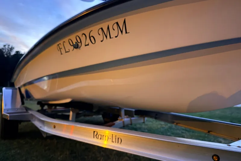 Slide: The Image of 2004 Hell's Bay Devilray boat on trailer at sunset, registration FL 926 MM. - 7