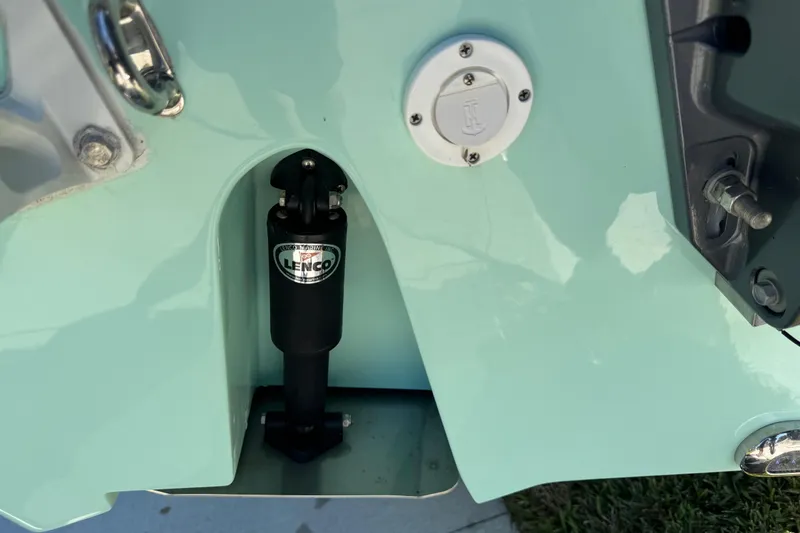 Slide: The Image of 2022 NauticStar 2602 Legacy boat with dual Yamaha engines on a trailer. - 16