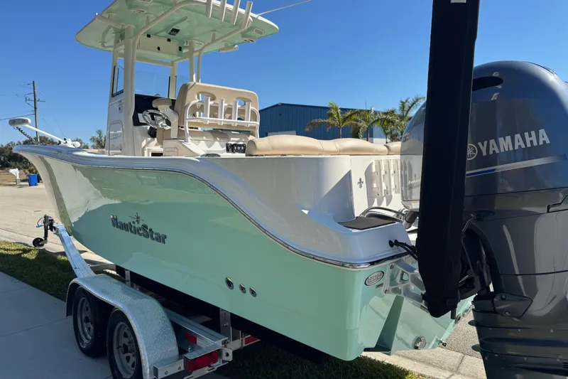 Slide: The Image of Sticker on 2022 NauticStar 2602 Legacy boat, "Lifetime Limited Hull Warranty, Wood Free Construction." - 19