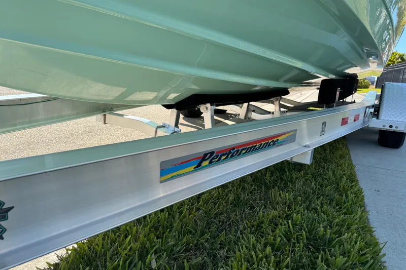 Slide: The Image of Trailer tire on a 2022 NauticStar 2602 Legacy boat trailer. - 27