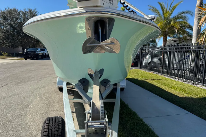 Slide: The Image of 2022 NauticStar 2602 Legacy boat on trailer, side view, sunny day. - 32