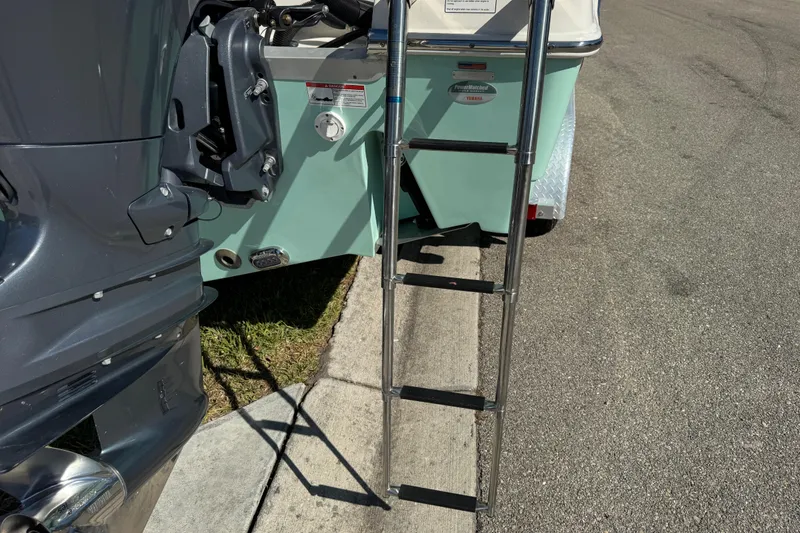 Slide: The Image of 2022 NauticStar 2602 Legacy boat interior with steering console and seating. - 35