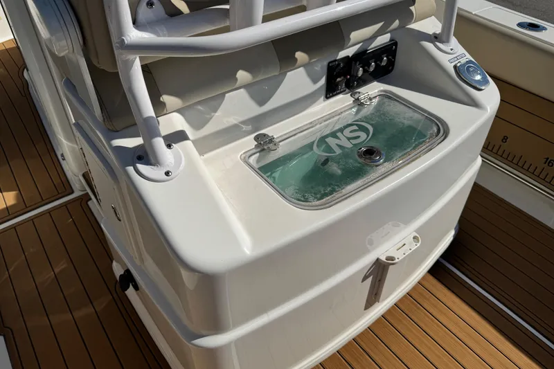 Slide: The Image of 2022 NauticStar 2602 Legacy boat interior with steering wheel and control panel. - 36