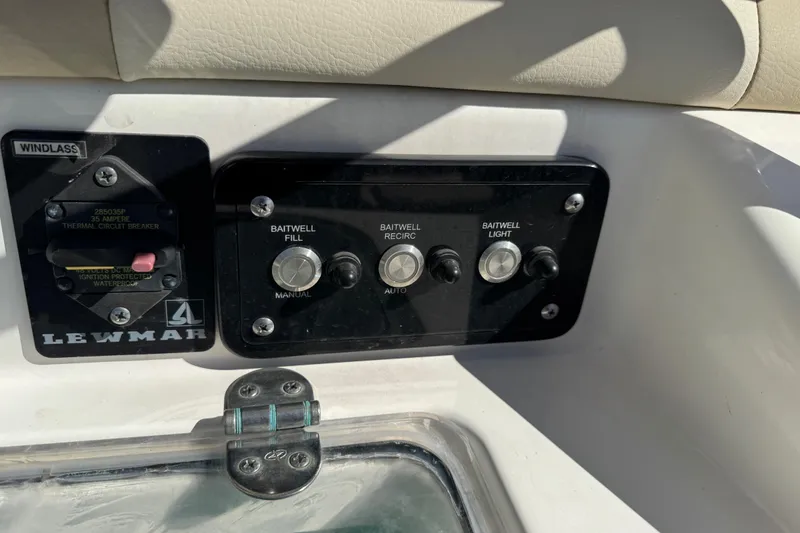 Slide: The Image of Infinity Bluetooth stereo system on a 2022 NauticStar 2602 Legacy boat dashboard. - 39