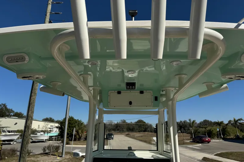 Slide: The Image of Remote control for NauticStar 2602 Legacy boat, featuring "Raptor" branding and directional buttons. - 42