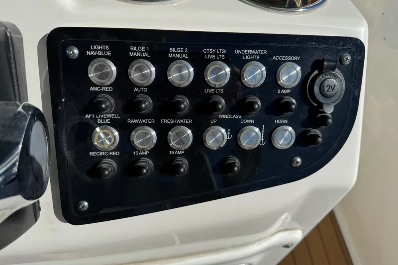 Slide: The Image of Simrad navigation display on 2022 NauticStar 2602 Legacy boat showing map and data. - 44