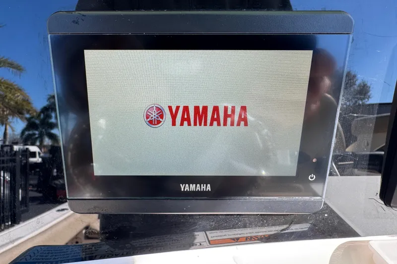 Slide: The Image of Control panel on 2022 NauticStar 2602 Legacy boat, featuring multiple switches. - 47