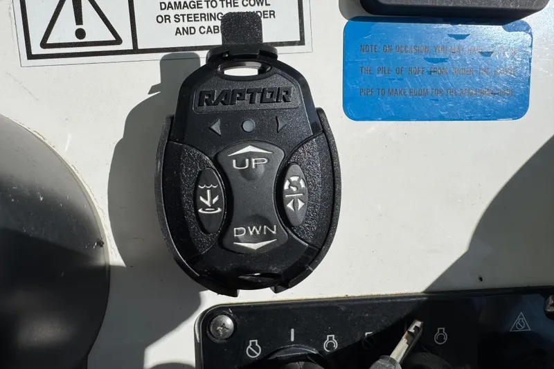 Slide: The Image of NauticStar 2602 Legacy 2022 boat emblem with American flag detail. - 48