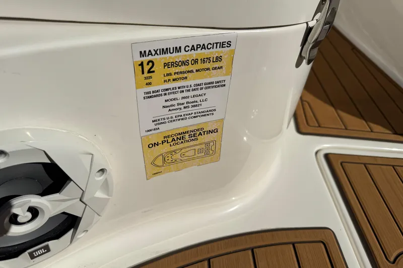 Slide: The Image of 2022 NauticStar 2602 Legacy boat interior with livewell and teak flooring. - 59