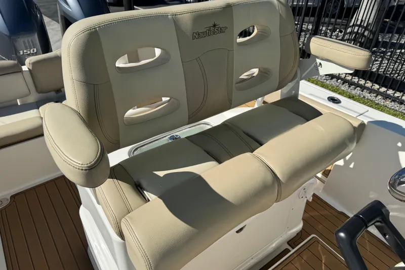 Slide: The Image of Control panel on 2022 NauticStar 2602 Legacy boat with baitwell and windlass switches. - 62