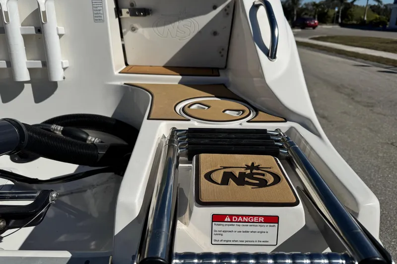 Slide: The Image of 2022 NauticStar 2602 Legacy boat with Lenco trim tab actuator. - 7