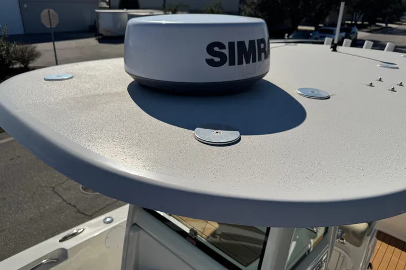 Slide: The Image of 2022 NauticStar 2602 Legacy boat with Simrad radar on the roof. - 71