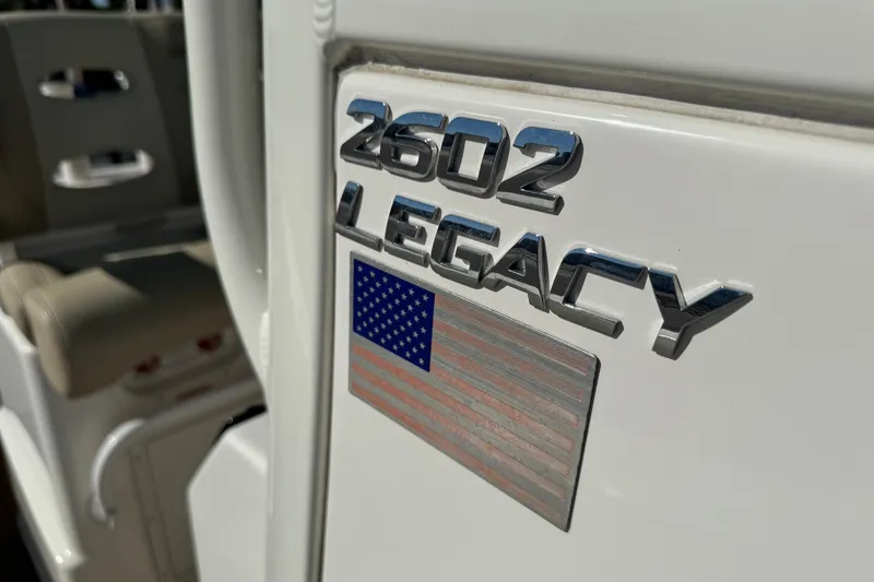 Slide: The Image of 2022 NauticStar 2602 Legacy boat emblem with American flag detail. - 79