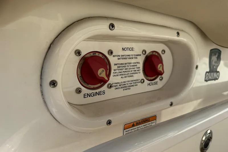 Slide: The Image of 2022 NauticStar 2602 Legacy boat battery control panel with engine and house switches. - 80