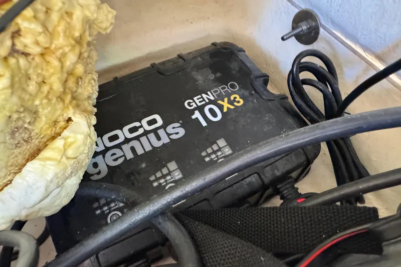 Slide: The Image of NOCO Genius GENPRO 10X3 charger in a 2022 NauticStar 2602 Legacy boat. - 83