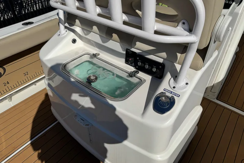 Slide: The Image of LED light fixture on 2022 NauticStar 2602 Legacy boat, close-up view. - 88