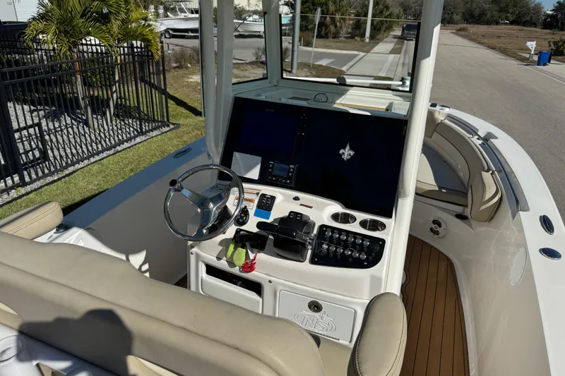 Slide: The Image of 2022 NauticStar 2602 Legacy boat with dual engines and Raptor anchor system. - 89