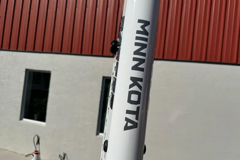 Slide: The Image of 2022 NauticStar 2602 Legacy boat with dual Yamaha 150 engines and Raptor anchor system. - 92