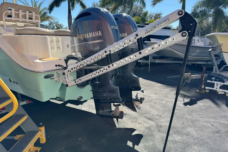 Slide: The Image of Simrad NSS evo3S and Yamaha F150 LF150 manuals on a table, 2022 NauticStar 2602 Legacy. - 94