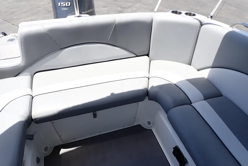 Slide: The Image of 2021 NauticStar 223 DC boat interior with gray and white seating. - 16