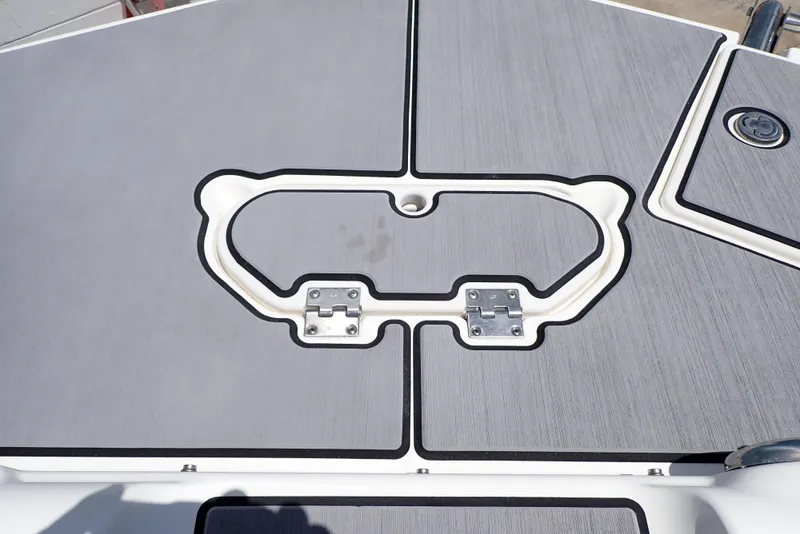 Slide: The Image of 2021 NauticStar 223 DC boat deck with sleek gray finish and secure fittings. - 29