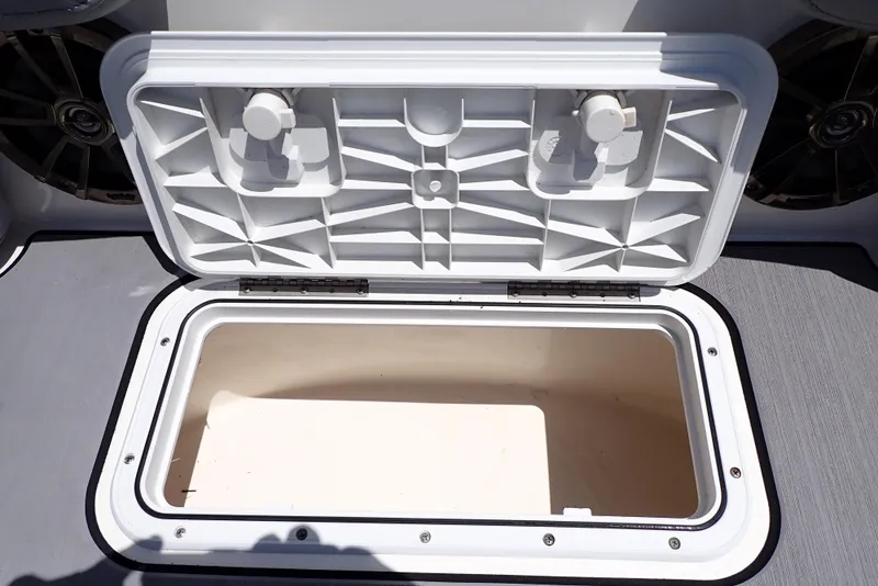 Slide: The Image of Open storage compartment on 2021 NauticStar 223 DC boat, showcasing interior space. - 33