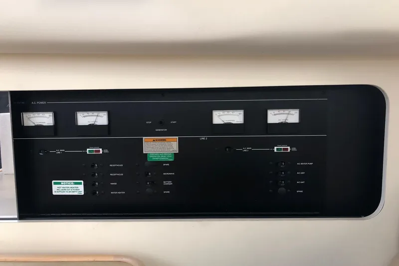 Slide: The Image of Control panel of a 1997 Carver 355 Aft Cabin Motor Yacht, featuring gauges and switches. - 18
