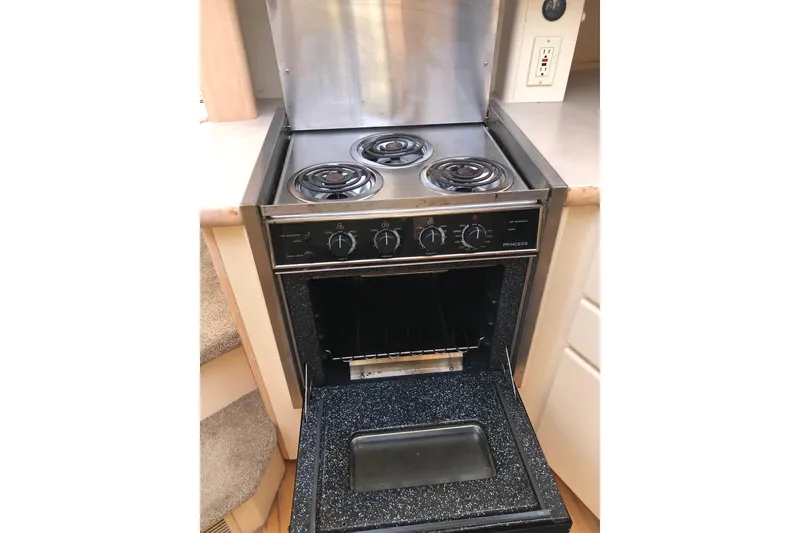 Slide: The Image of Electric stove and oven in 1997 Carver 355 Aft Cabin Motor Yacht kitchen. - 23