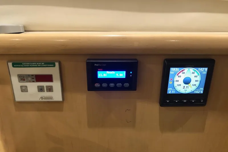 Slide: The Image of Control panel on 1997 Carver 355 Aft Cabin Motor Yacht, featuring navigation and system displays. - 17