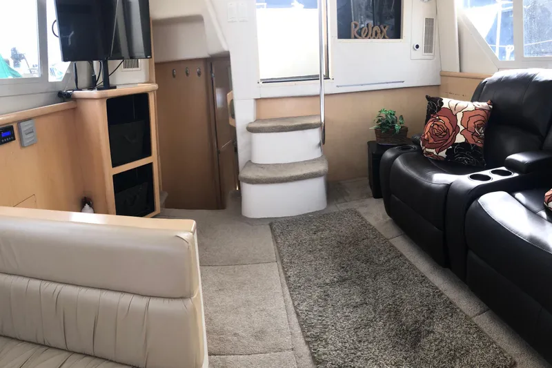 Slide: The Image of Interior of 1997 Carver 355 Aft Cabin Motor Yacht with cozy seating and modern amenities. - 27