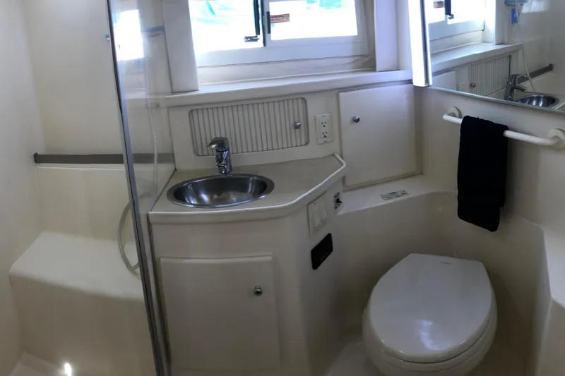 Slide: The Image of Bathroom interior of 1997 Carver 355 Aft Cabin Motor Yacht with sink and toilet. - 31