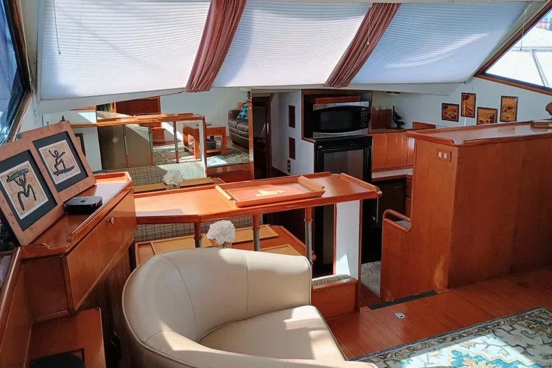 Slide: The Image of Luxurious interior of 1988 Vantare 46' Aft Cabin Wide Body MY yacht with elegant wood finishes. - 14