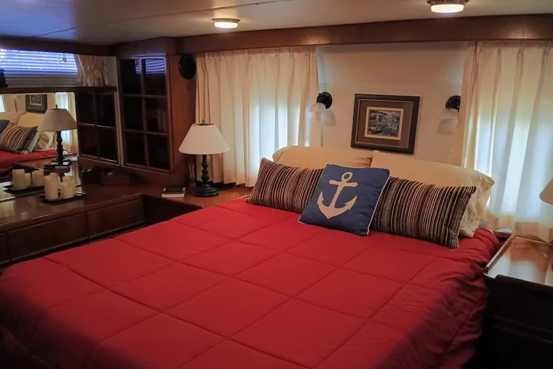 Slide: The Image of Cozy bedroom in 1988 Vantare 46' Aft Cabin Wide Body MY with nautical decor. - 31