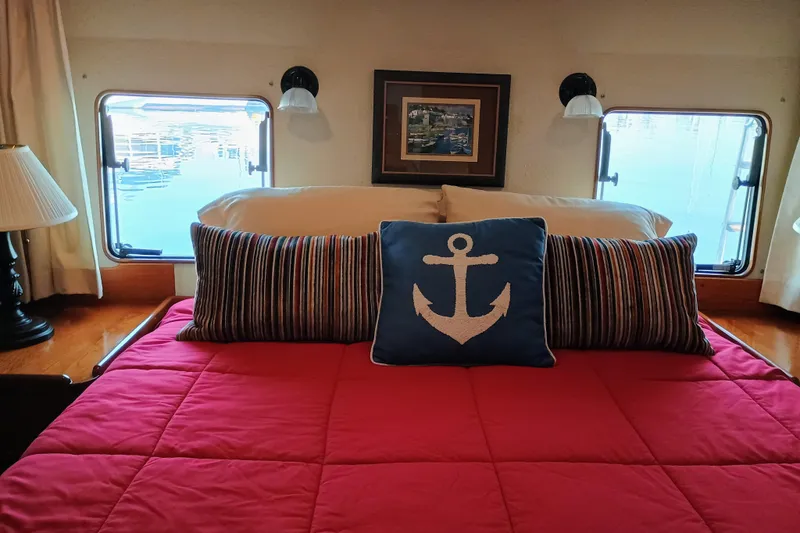 Slide: The Image of Cozy bedroom in 1988 Vantare 46' Aft Cabin yacht with nautical-themed decor. - 32
