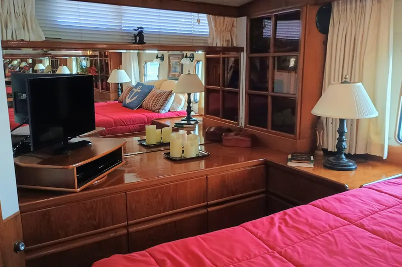 Slide: The Image of Luxurious 1988 Vantare 46' Aft Cabin interior with elegant wood finish and cozy decor. - 34