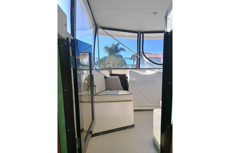 Slide: The Image of 1988 Vantare 46' Aft Cabin Wide Body MY interior with seating and windows. - 42