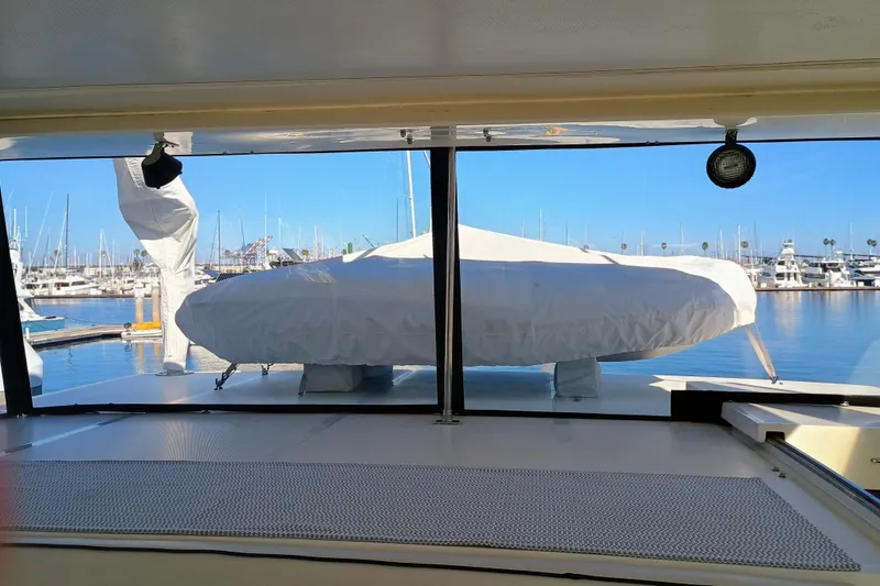 Slide: The Image of 1988 Vantare 46' Aft Cabin Wide Body MY interior with marina view. - 47