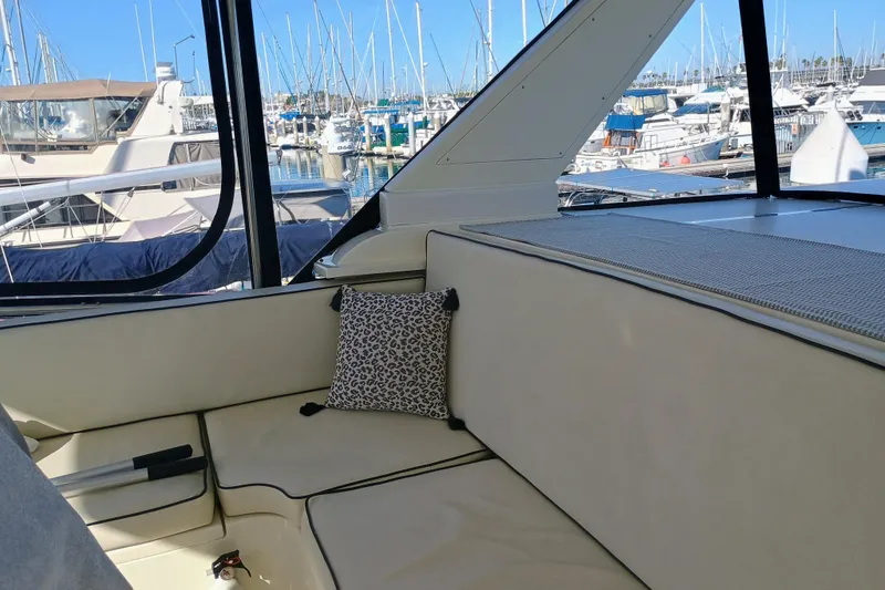 Slide: The Image of 1988 Vantare 46' Aft Cabin Wide Body MY docked at marina, sunny day. - 58
