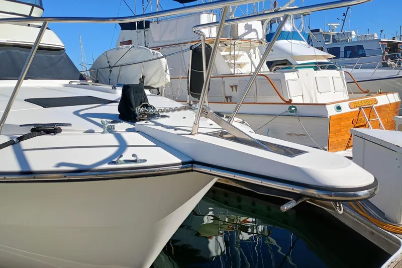 Slide: The Image of 1988 Vantare 46' Aft Cabin Wide Body MY yacht docked, side view. - 60