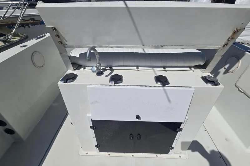 Slide: The Image of 1997 Stamas 270 Tarpon boat interior with sink and storage compartments. - 3