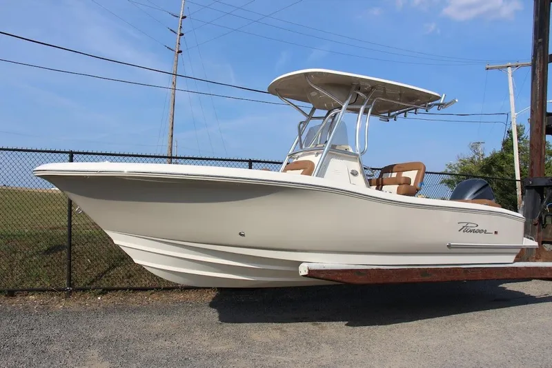 The Image of 2025 Pioneer 222 Islander boat on trailer, side view, outdoors. - 0