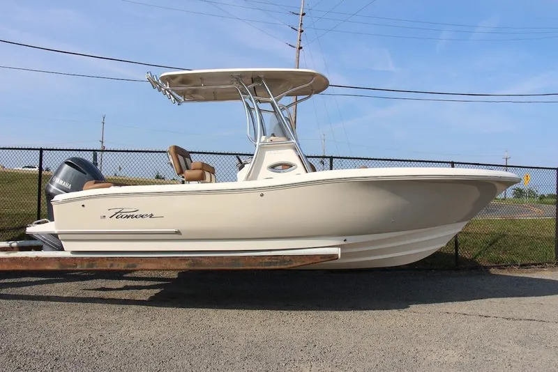 Slide: The Image of 2025 Pioneer 222 Islander boat on trailer, side view, outdoors. - 10